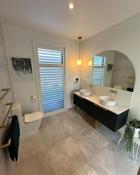 Full bathroom tiled by SRL Tiling with double vanity and large-format floor
